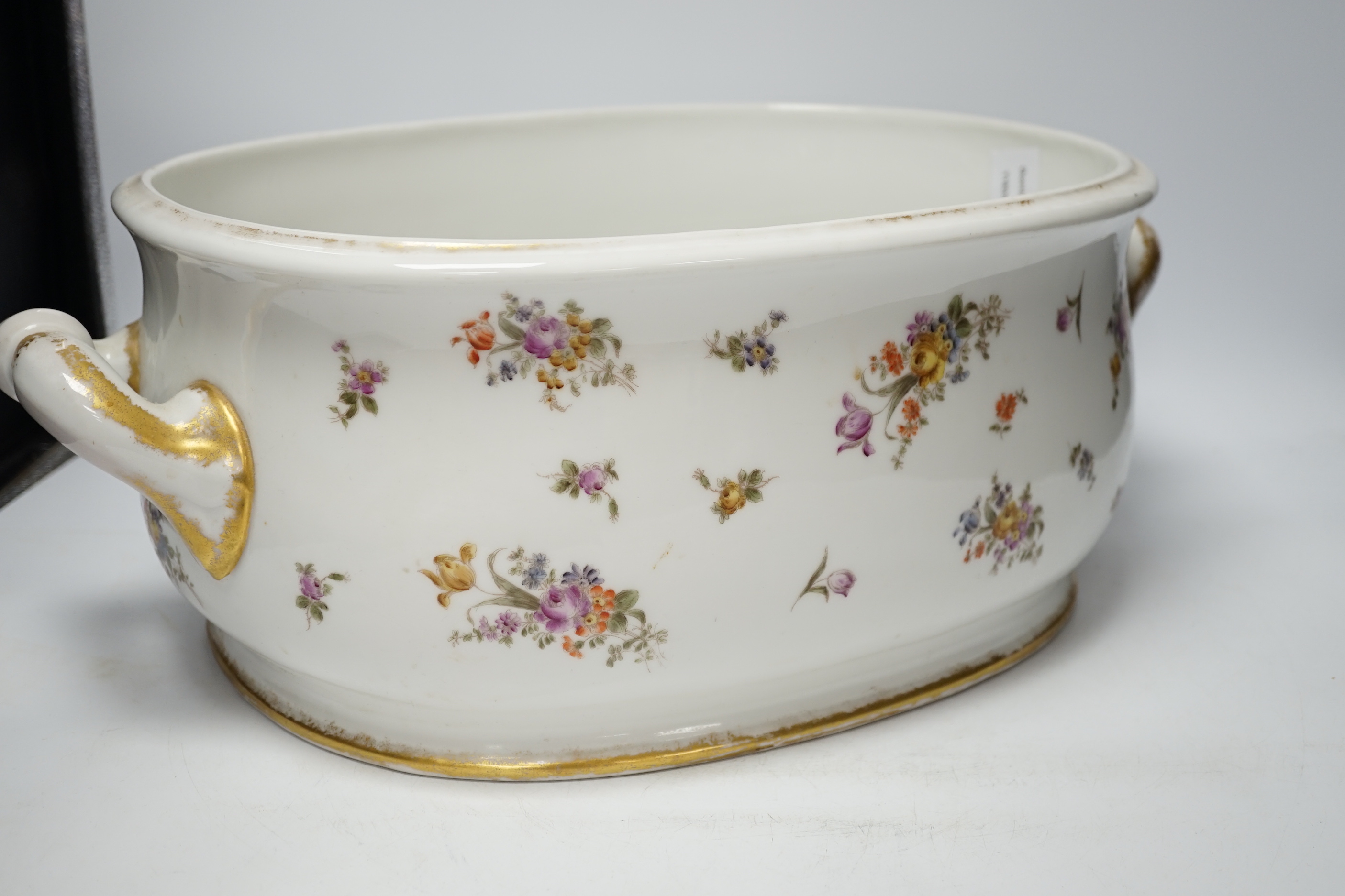 An Edwardian porcelain floral and gilt decorated foot bath, top 40cm wide not including handles